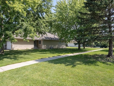 End unit with desirable loads of green space to the side and rear.