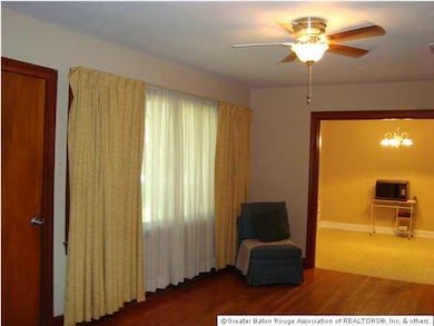 The Living Room has the original beautiful real wo