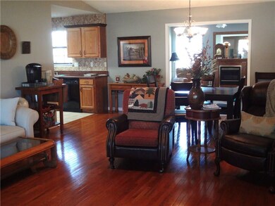 Living room looking into kitchen and den.