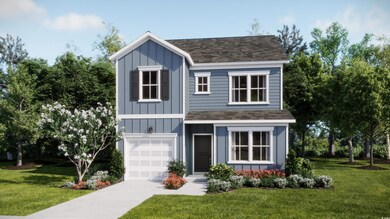 View of front of home with a garage and a front ya