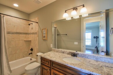 Full Bath adjoins the office or guest bedroom on the main floor.