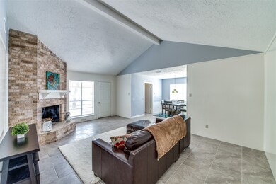 Spacious family room with a cozy fireplace.
