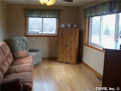 Living Room. Formal living room has many windows f
