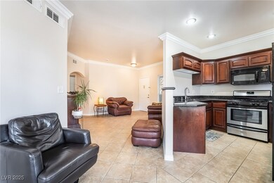Kitchen featuring dark countertops, open floor pla