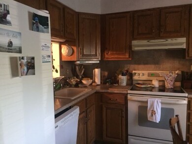 Stainless sink, updated counter top in neutral tones.
