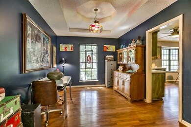 Formal dining room adjoins kitchen for convenient 
