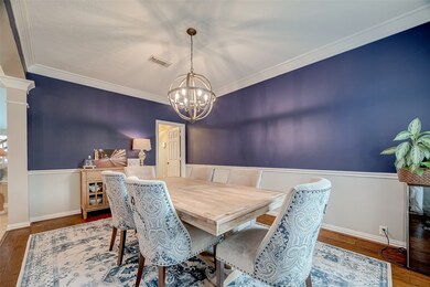 Beautiful crown molding and new light fixture gives this room elegance.