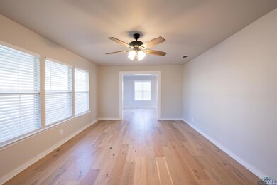 Empty room with light hardwood / wood-style floori