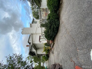 exterior view of family room, deck, and driveway