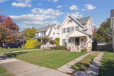 View of front of house with a front lawn and covered porch