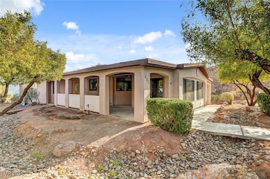 View of front facade with stucco siding