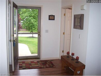 Spacious foyer with newer flooring welcomes you in