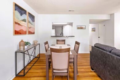 Dining room with light wood finished floors and b