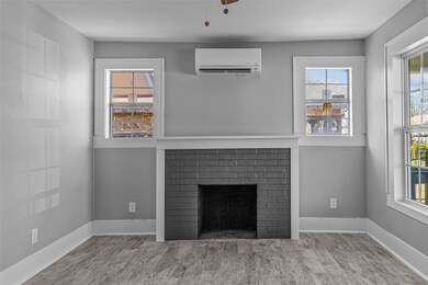 Unfurnished living room with a wealth of natural l