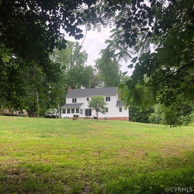 Lovely hardwood trees fully enclose the property a