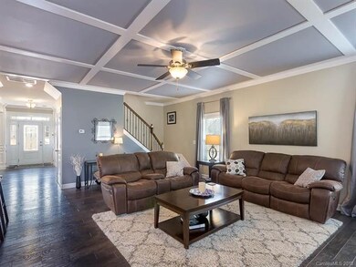Stunning coffered ceiling gives this living room t