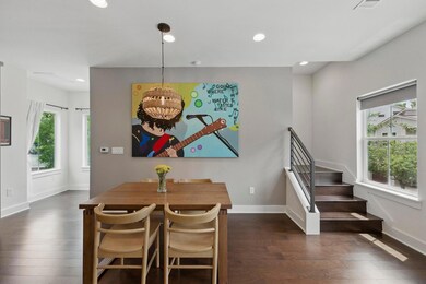 Dining area featuring baseboards, dark wood-style