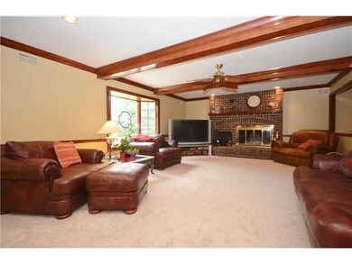 Family Room. BEAMED CEILING IS WELL SUITED TO THE 