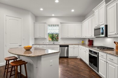 Beautiful kitchen with large island, tons of white
