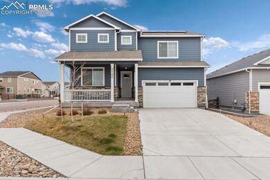 Craftsman house with covered porch, stone siding, 