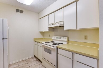The kitchen has lots of storage and counter space.
