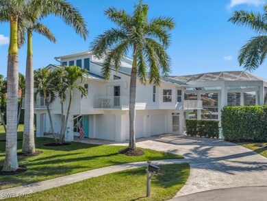 View of front of property featuring a balcony, a g