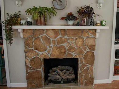 Living Room. The fireplace has a gas...