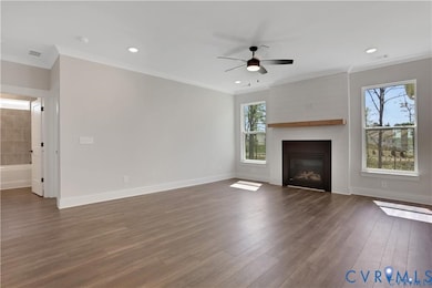 Photo represents the plan, not the actual home. Design selections may vary. A spacious family room with gas fireplace.
