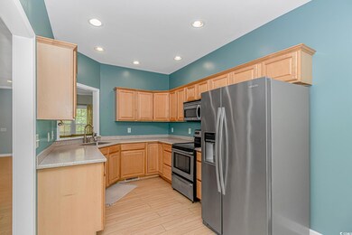 Kitchen featuring stainless steel appliances, ligh
