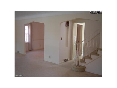 Living Room to open staircase and hall to Kitchen.