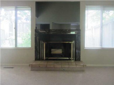 Living room overlooks your own fenced patio