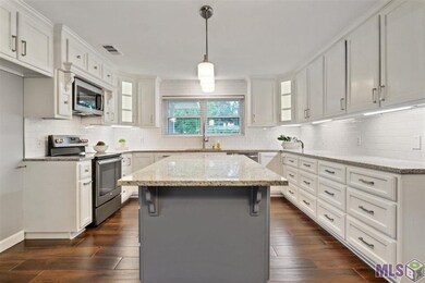 Beautiful kitchen with island. Over 20 pull out dr
