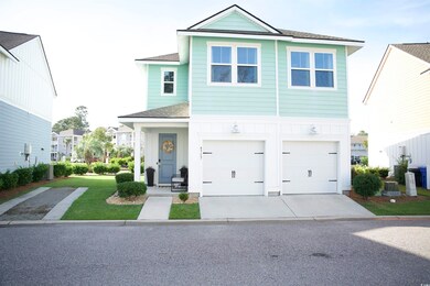 View of front facade featuring a front lawn and a 