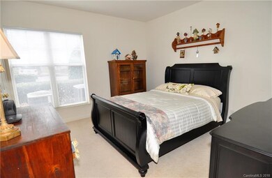 Bedroom one, right of entry hall featuring a doubl