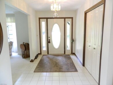 Welcoming Ceramic Foyer Entry with Large Guest Clo