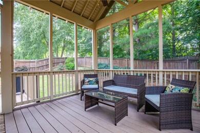 This screene-in porch is divine! Perfect spot to e