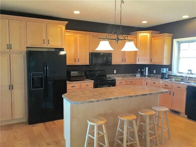 The Kitchen has a great Island that seats four.  l