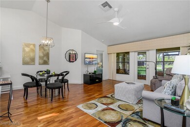Living area with wood finished floors, ceiling fan