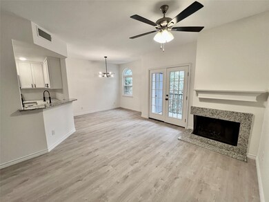 Unfurnished living room with ceiling fan with nota