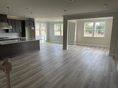 Kitchen featuring tasteful backsplash, baseboards,