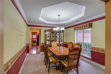 Formal dining room with a beautiful trey ceiling!