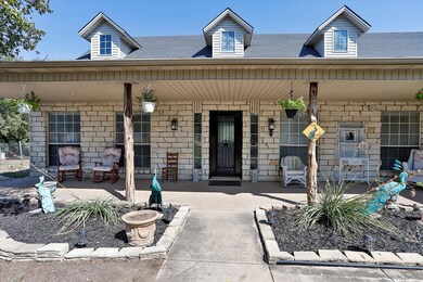 View of exterior entry with a large covered front 