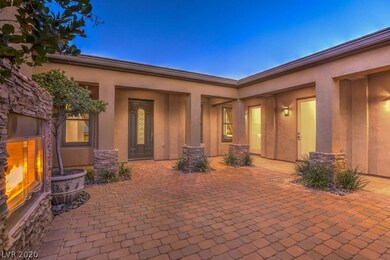 Courtyard with fireplace and French Doors entrance