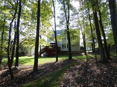 This large rear yard offers privacy and is surrounded by a mature treeline.