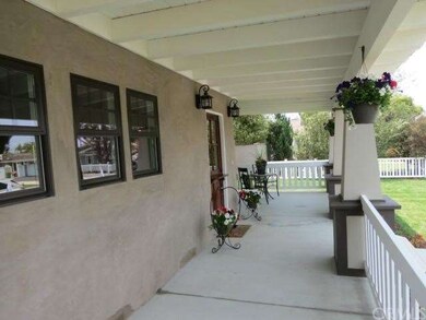 The Covered Front Porch Spans The Entire Front Of 