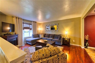 The living room has open feel with the enlarged op