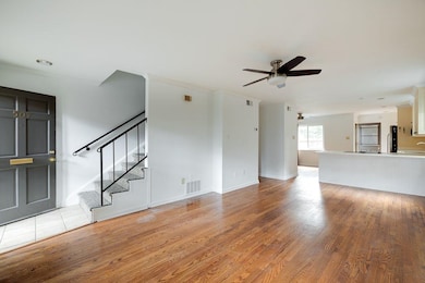 Unfurnished living room featuring ornamental moldi