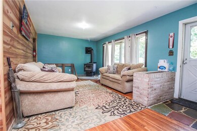Enter into the large living room with hard wood fl