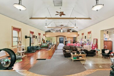 the main floor living area is an open concept design with vaulted ceilings. Arched windows flood the space with natural light.