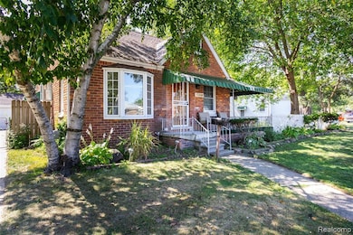 Bungalow with brick siding, a porch, and roof with shingles
